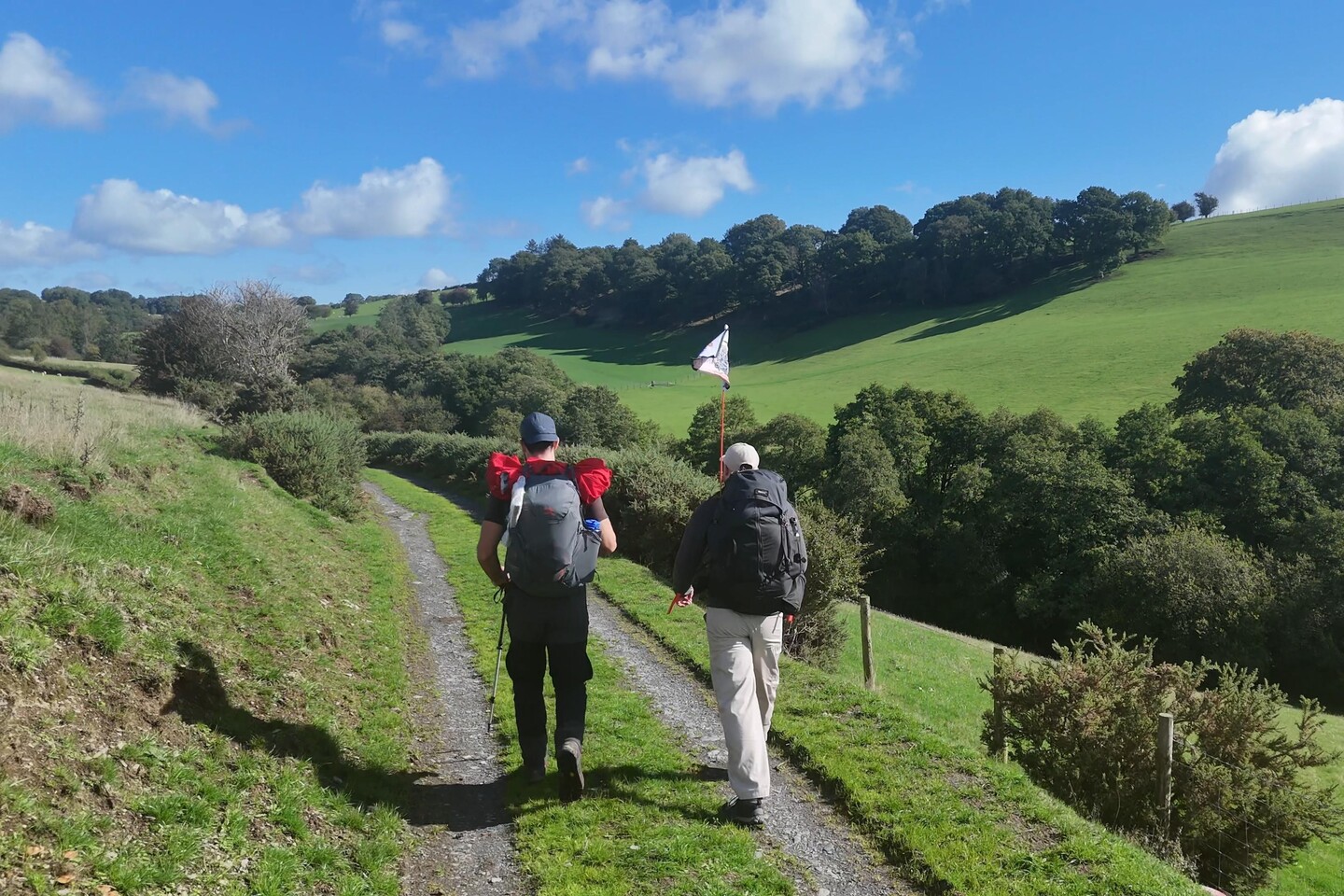 Sam and Alex hiking through the Welsh countryside on Day 2