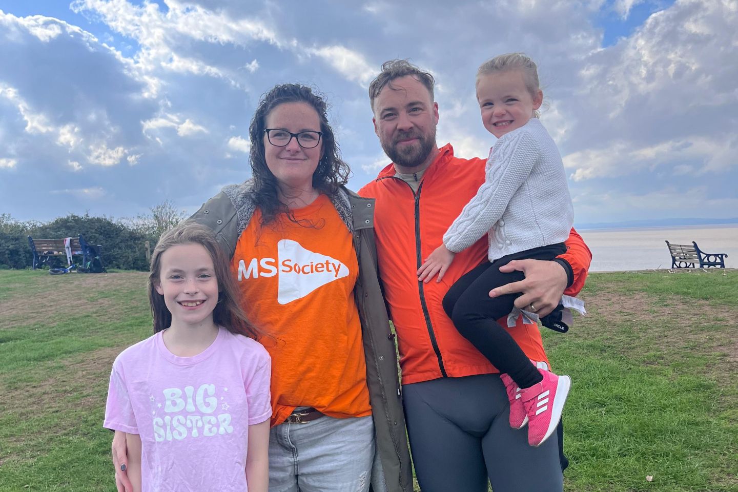 Sam embracing his family at the finish line, Battery Point, Portishead