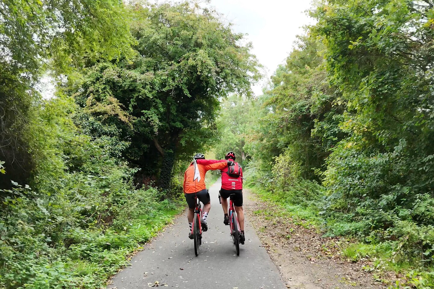 Sam and his dad Graham cycling together on the final day