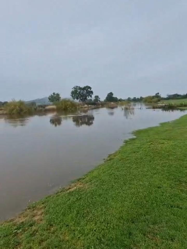 The same put-in point completely flooded during the expedition — the river not yet even at peak level